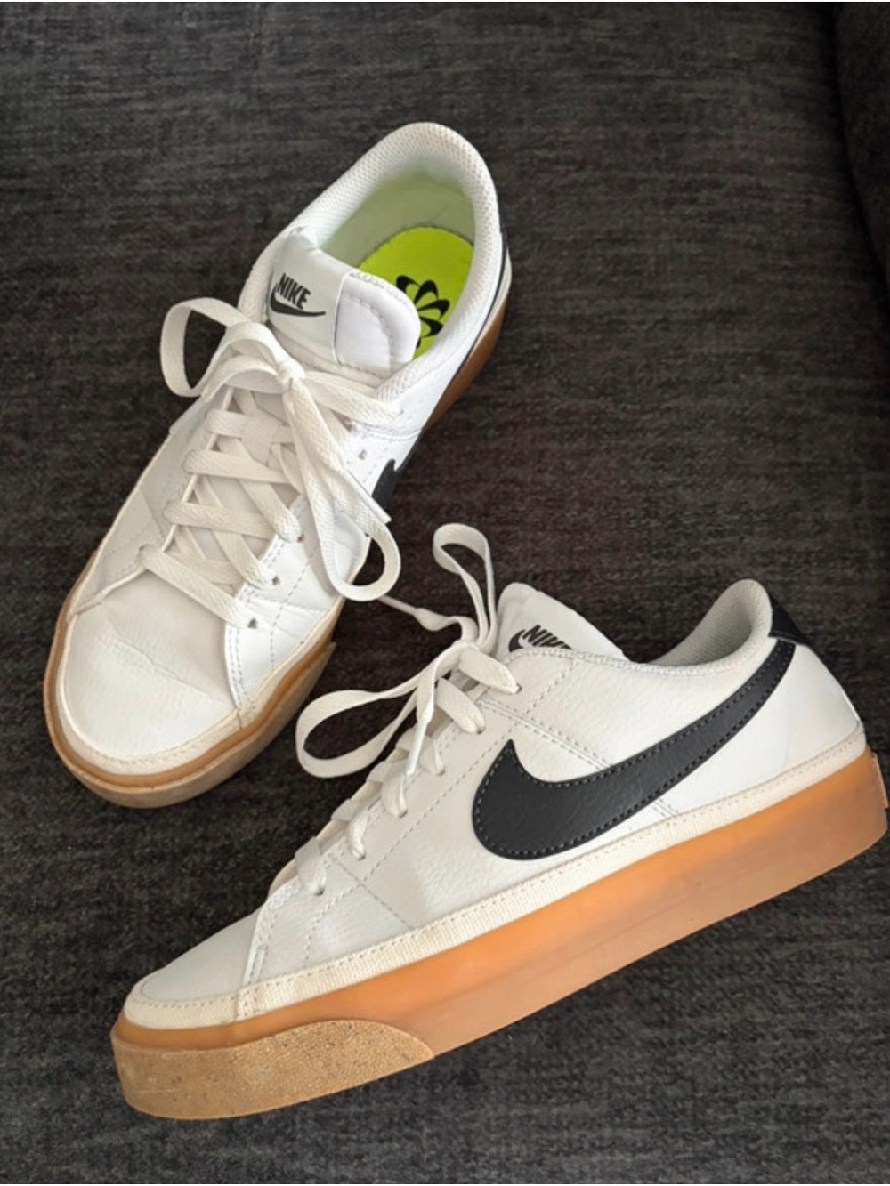 Nike White Low-Top Leather Sneakers with Black Swoosh and Gum Sole